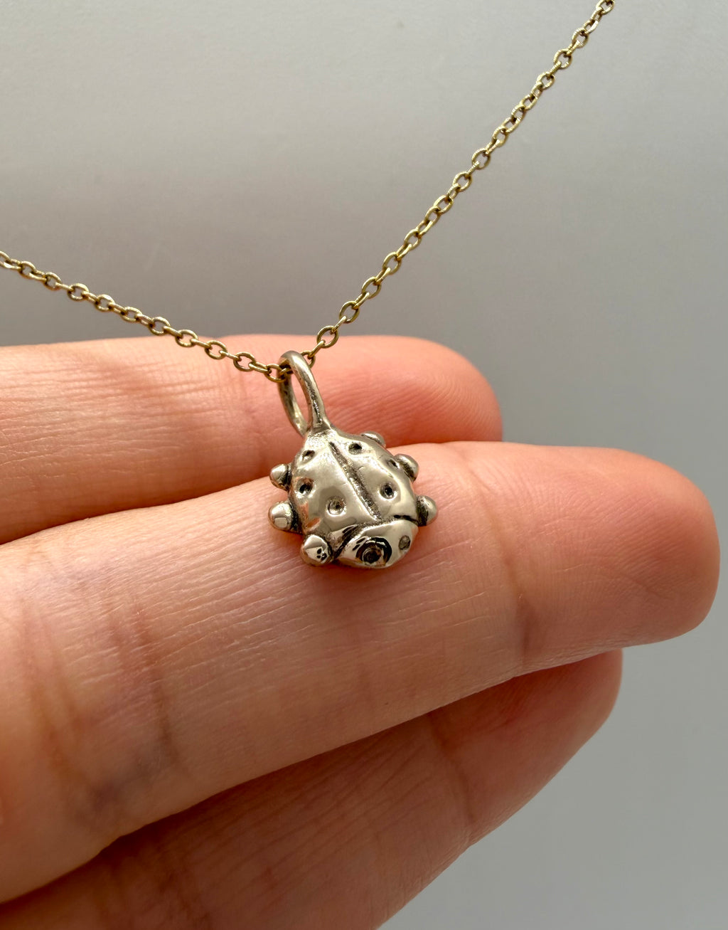Love bug charm necklace